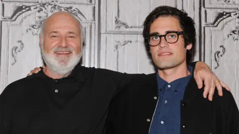 Director Rob Reiner and
                                  his son Nick Reiner hold arms around each
                                  other's shoulders as they attend AOL Build
                                  Presents: 